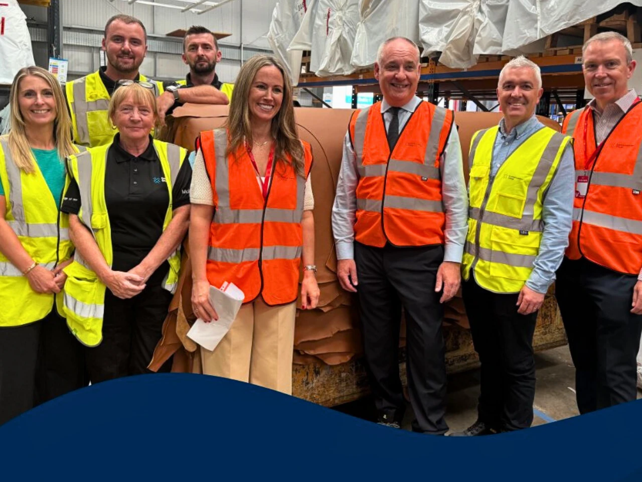 business and employment minister richard lochhead with workers at scottish leather group near bridge of weir saying, the new funding will help provide flexiable and supportive working environment.